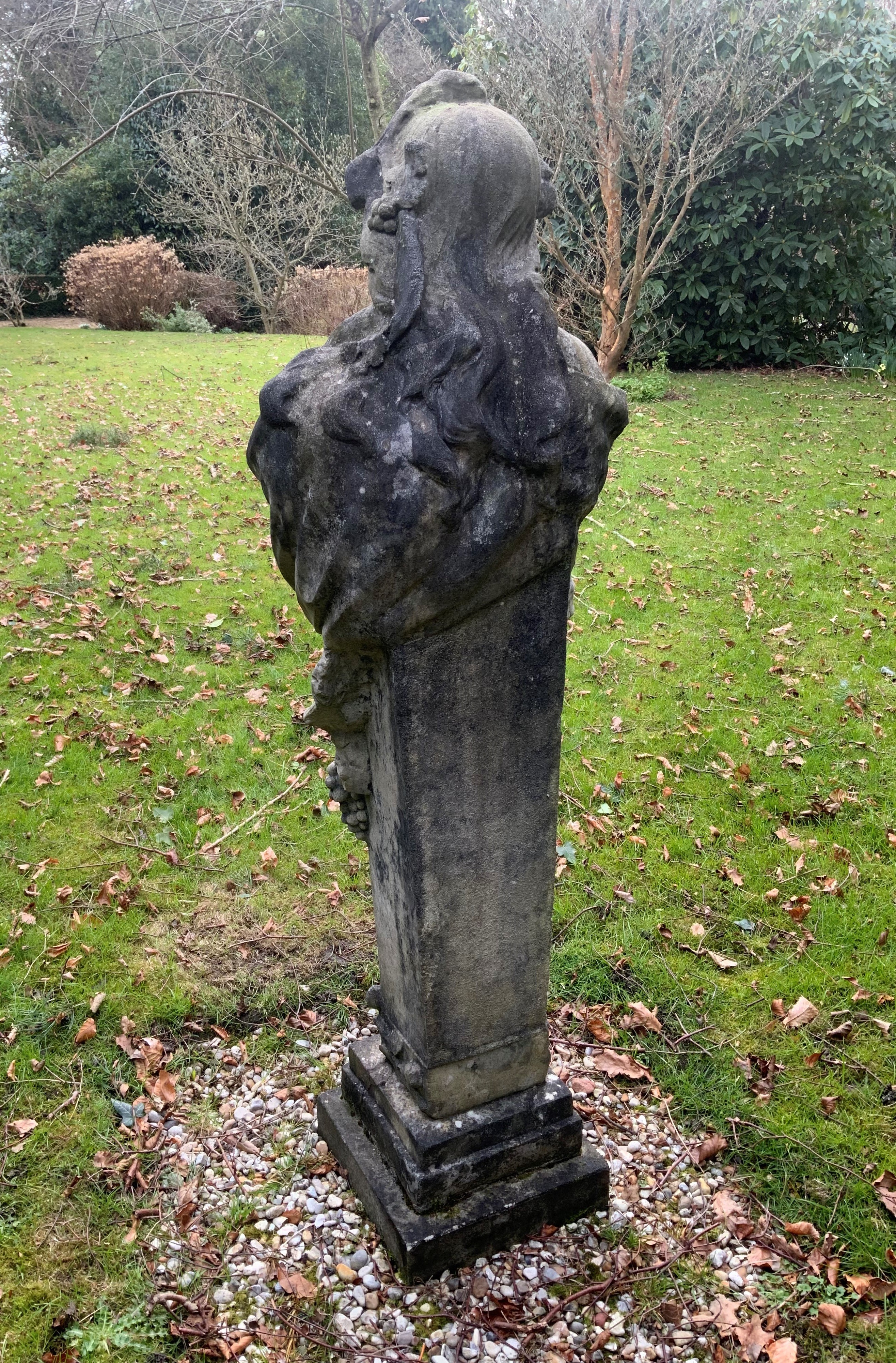 A reconstituted stone figure of a term, on a stepped square plinth, height 156cm